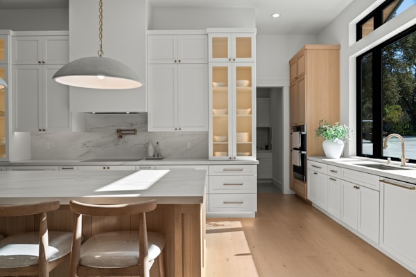 Modern kitchen renovation with premium pendant lighting and natural wood accents